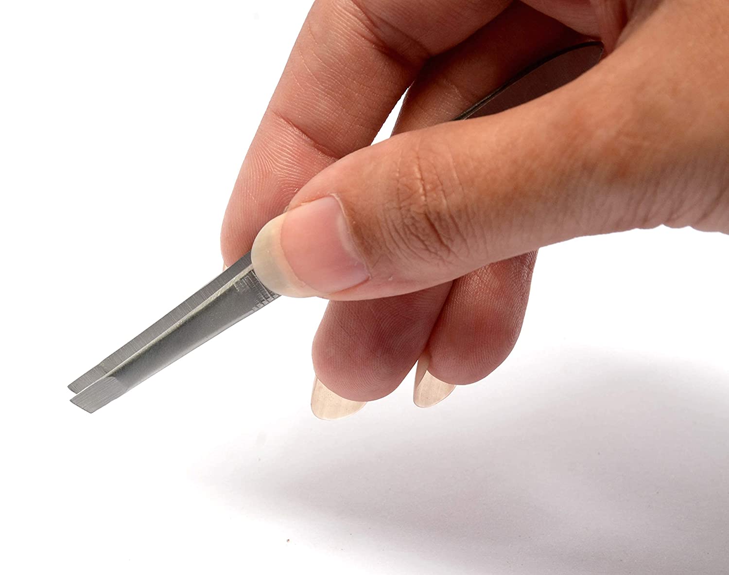 Eyebrow tweezer with slant tip for shaping eyebrows